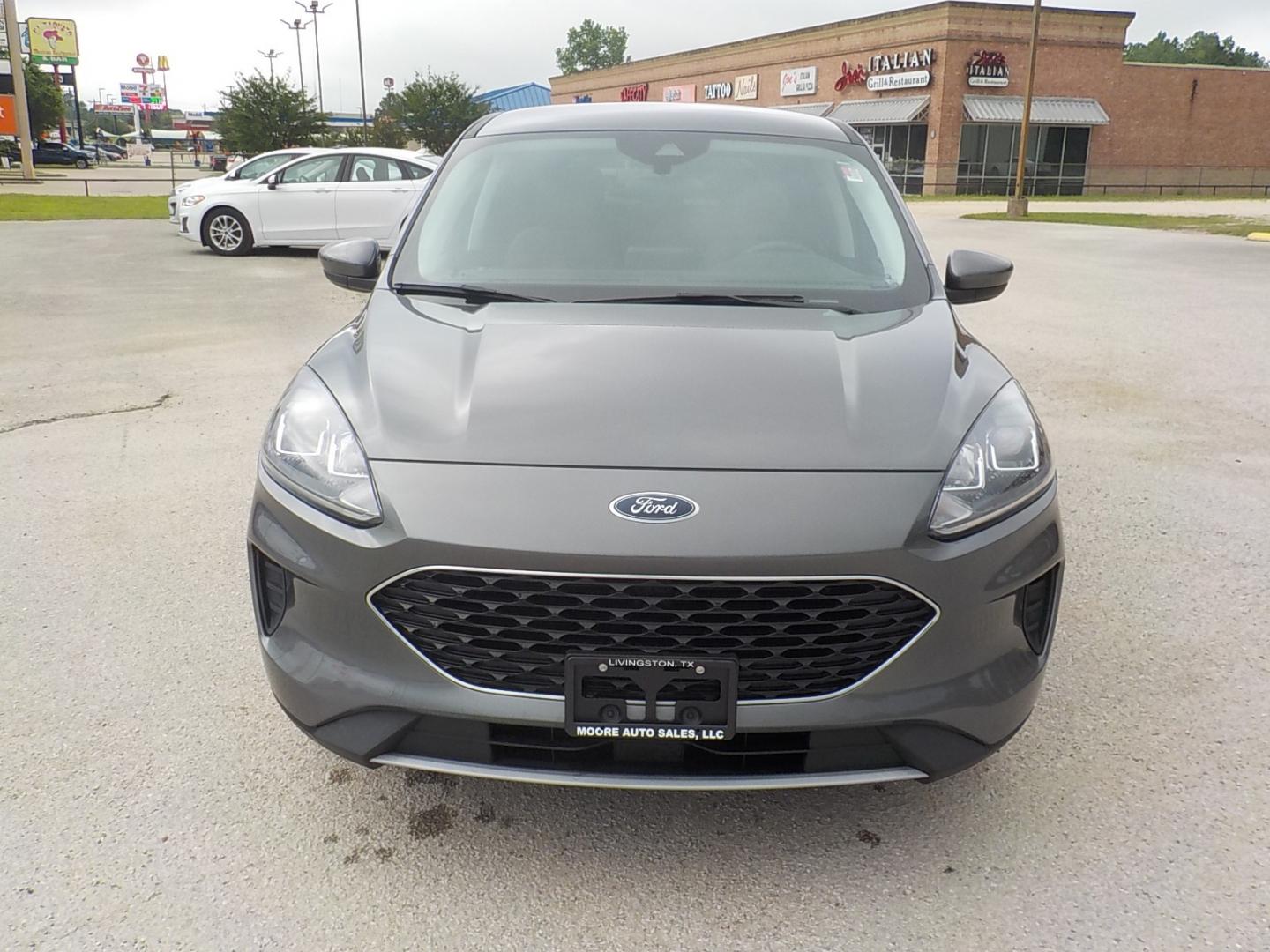 2021 Gray /Lt gray Ford Escape (1FMCU0G66MU) , Auto transmission, located at 1617 W Church Street, Livingston, TX, 77351, (936) 327-3600, 30.710995, -94.951157 - These vehicles get over 30 mpg on the highway!! - Photo#1